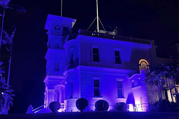 Government House - the official residence of the Sovereign’s personal representative in Queensland - was awash with purple on Sunday evening, 6 February 2022.